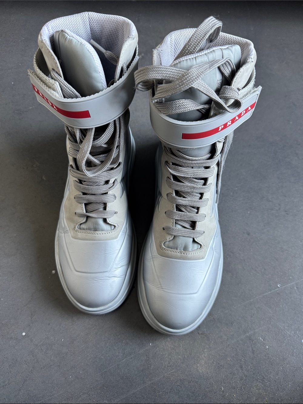 Prada Light Gray High-Top Lace-Up Boots with Red Logo Strap